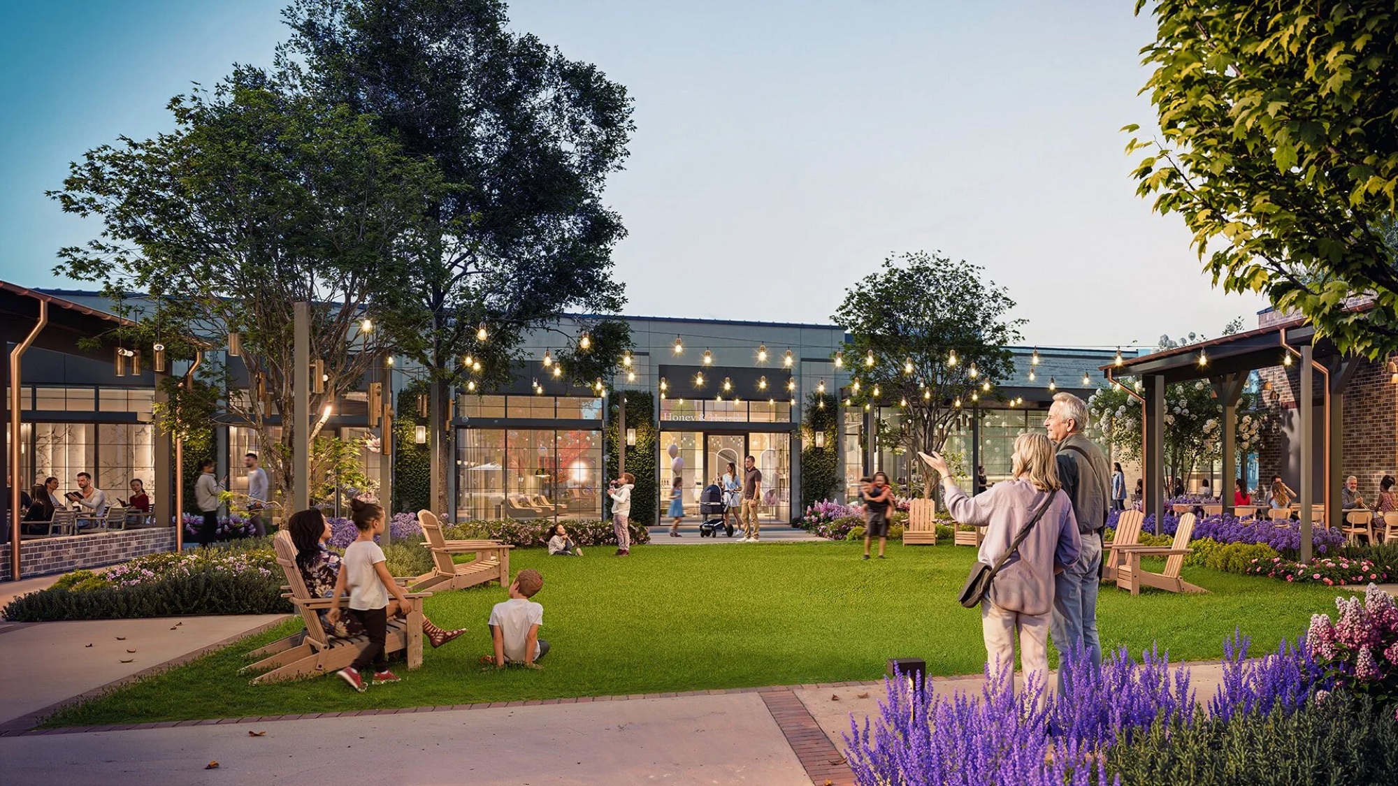Rendering of the community green at Hillrose Market, with lawn, seating and surrounding mixed-use buildings.